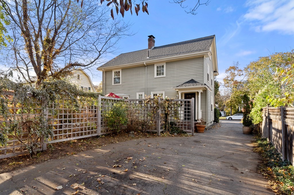 63 Oak Ridge Road Medford, MA 02155 - Photo 9 of 40 a view of a house with a yard