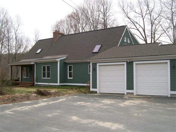 120 Rocky Hill Road Scituate, RI 02857 - Photo 1 of 14 a front view of a house with a yard and garage