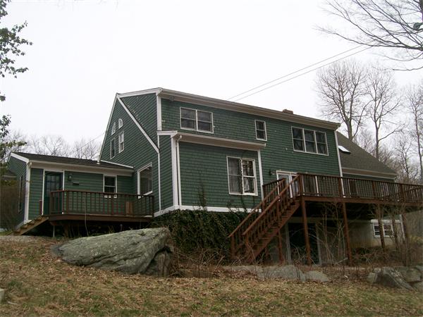 120 Rocky Hill Road Scituate, RI 02857 - Photo 11 of 14 a front view of a house with a yard