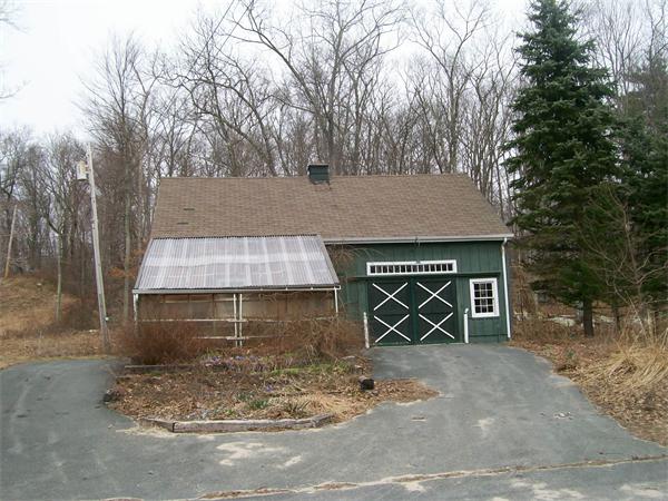 120 Rocky Hill Road Scituate, RI 02857 - Photo 12 of 14 a front view of a house with parking