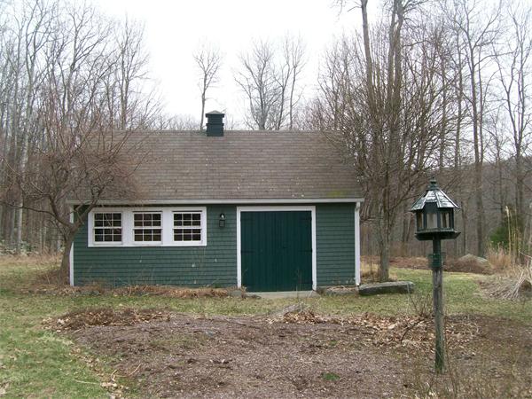 120 Rocky Hill Road Scituate, RI 02857 - Photo 14 of 14 a front view of a house with a yard and garage
