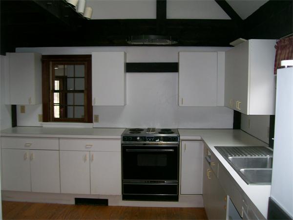 120 Rocky Hill Road Scituate, RI 02857 - Photo 5 of 14 a kitchen with granite countertop white cabinets and stainless steel appliances
