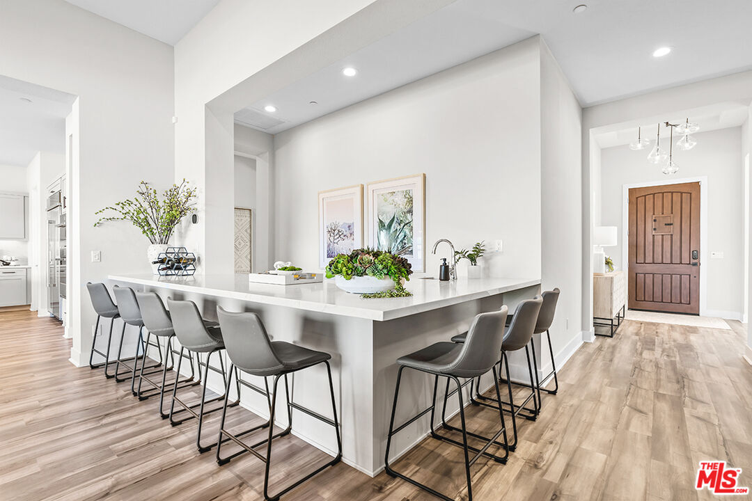 80464 Old Rnch Trail North La Quinta, CA 92253 - Photo 14 of 42 a view of a dining room with furniture and wooden floor