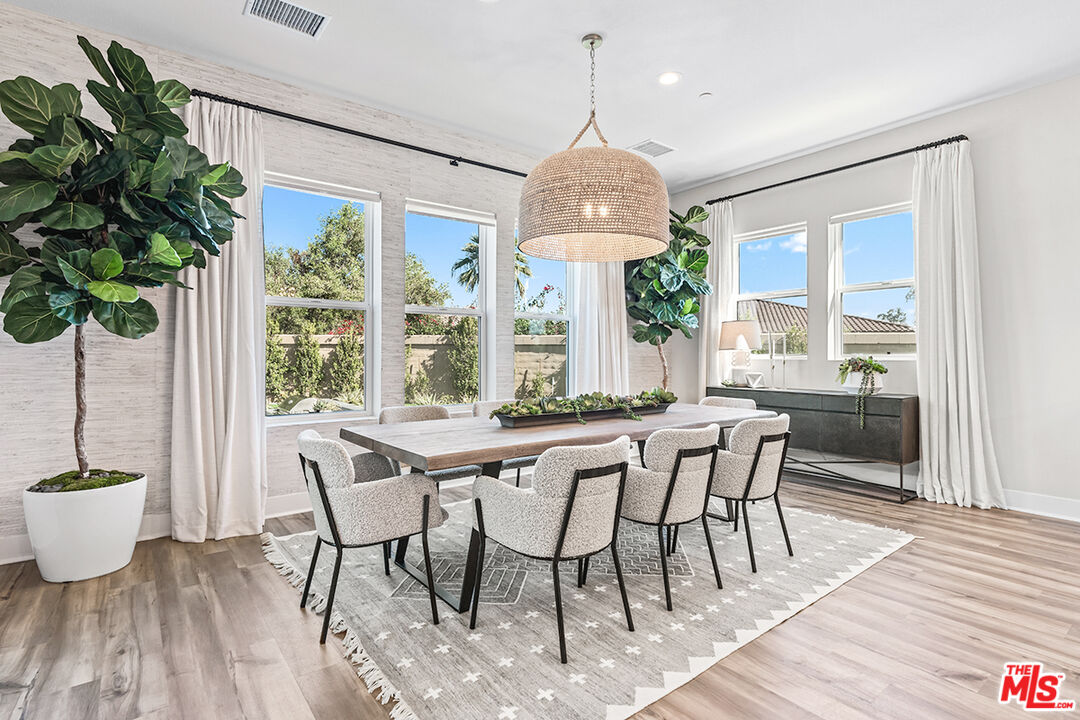 80464 Old Rnch Trail North La Quinta, CA 92253 - Photo 18 of 42 a view of a dining room with furniture window and wooden floor