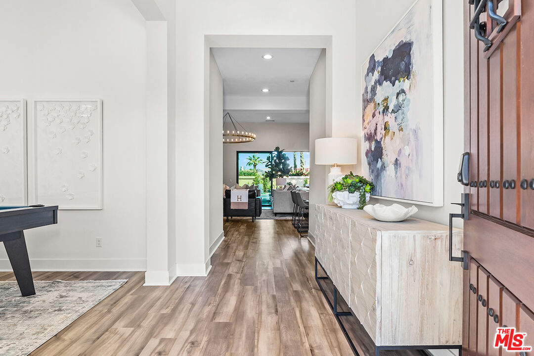 80464 Old Rnch Trail North La Quinta, CA 92253 - Photo 23 of 42 a view of a hallway and a livingroom with furniture