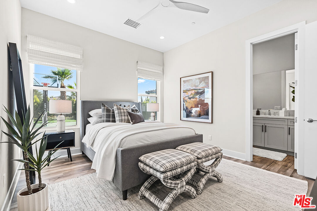 80464 Old Rnch Trail North La Quinta, CA 92253 - Photo 27 of 42 a bedroom with a bed and wooden floor
