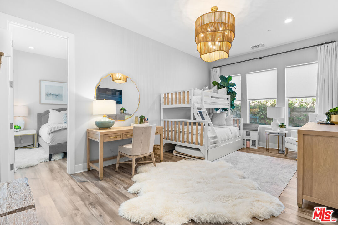 80464 Old Rnch Trail North La Quinta, CA 92253 - Photo 31 of 42 a living room with furniture a rug and a chandelier