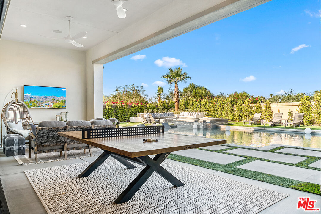 80464 Old Rnch Trail North La Quinta, CA 92253 - Photo 35 of 42 a living room with a couch and a table