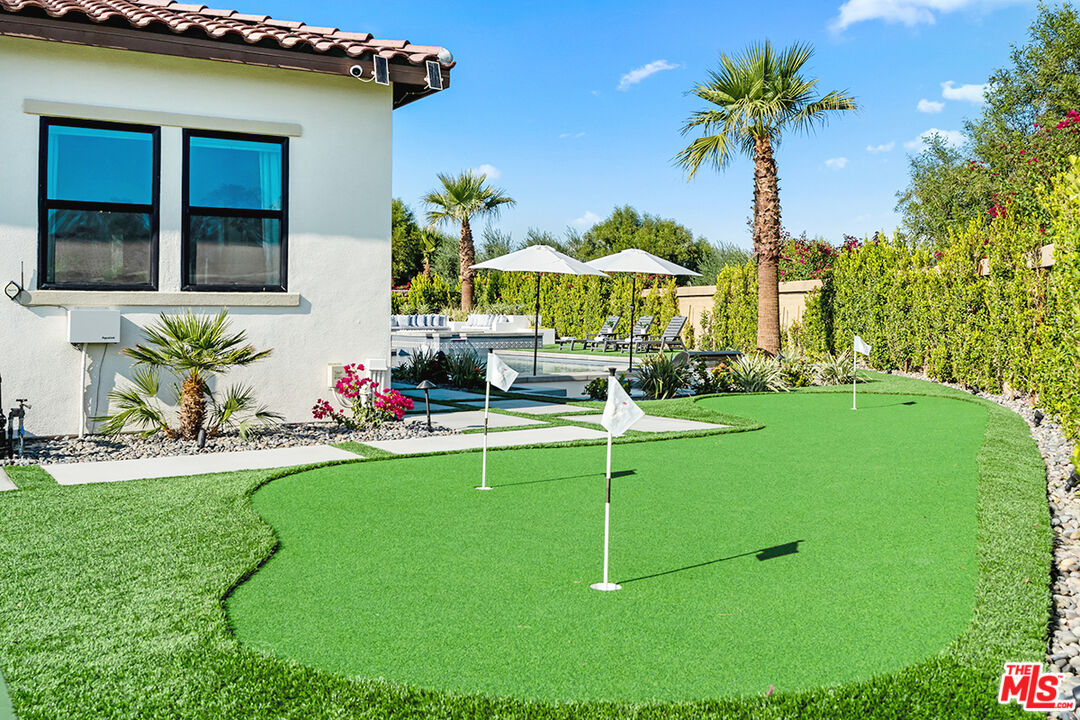 80464 Old Rnch Trail North La Quinta, CA 92253 - Photo 36 of 42 a view of a house with backyard porch and sitting area