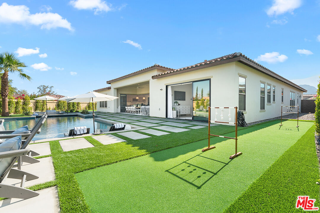 80464 Old Rnch Trail North La Quinta, CA 92253 - Photo 38 of 42 a view of a house with a backyard porch and sitting area