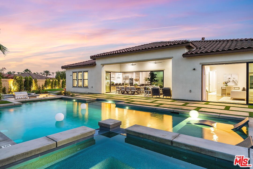 80464 Old Rnch Trail North La Quinta, CA 92253 - Photo 39 of 42 a view of a swimming pool with outdoor seating