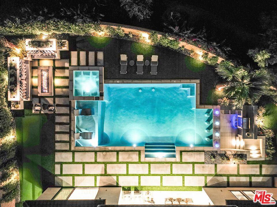 80464 Old Rnch Trail North La Quinta, CA 92253 - Photo 41 of 42 a view of a brick building with a large tree