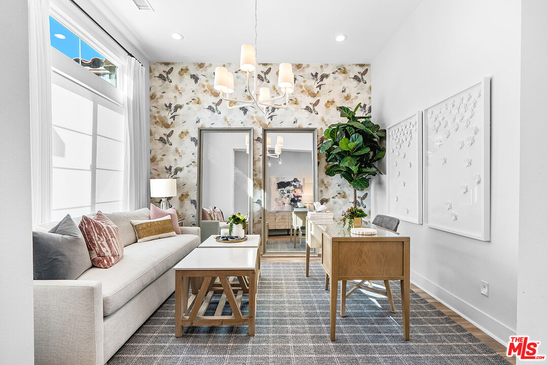 80464 Old Rnch Trail North La Quinta, CA 92253 - Photo 9 of 42 a living room with furniture and a chandelier