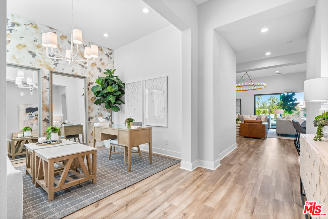 80464 Old Rnch Trail North La Quinta, CA 92253 - Photo 10 of 42 a living room with furniture and a chandelier