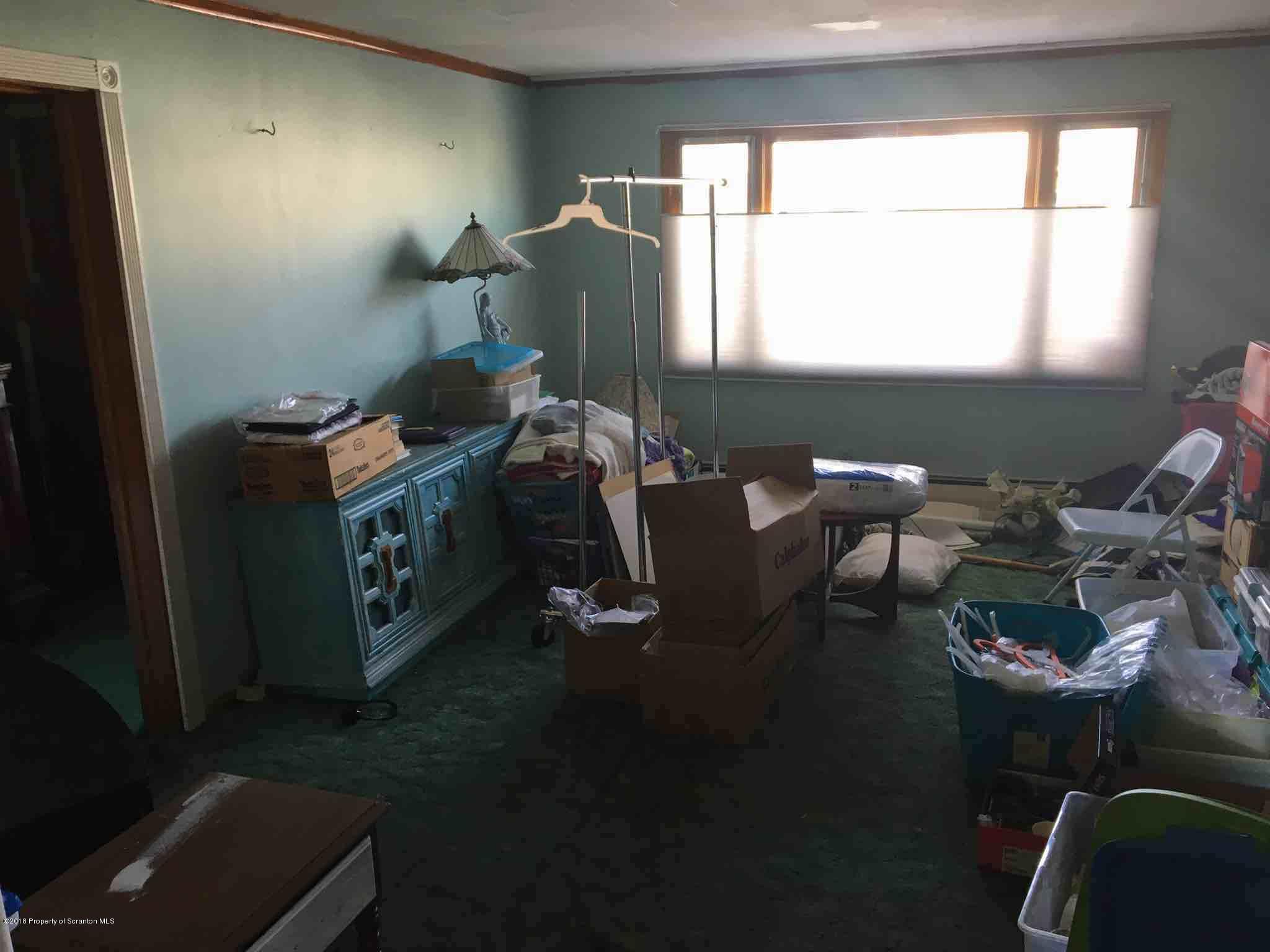 26 Main Street Inkerman, PA 18640 - Photo 9 of 16 a workspace with furniture and a window
