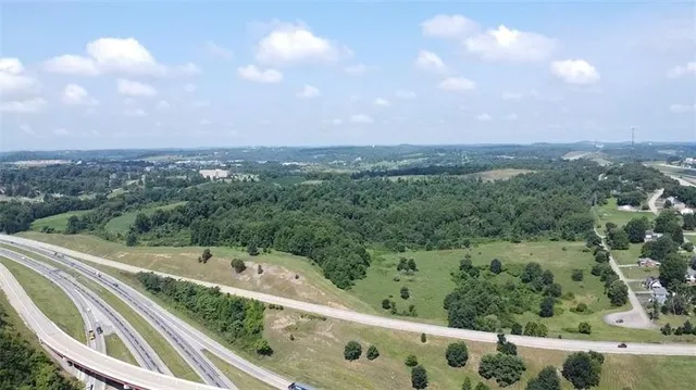 a view of a balcony with trees in the background