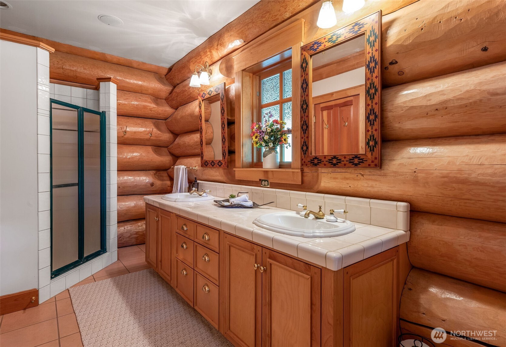 53 Combs Place Port Townsend, WA 98368 - Photo 22 of 40 a bathroom with a double vanity sink and a mirror