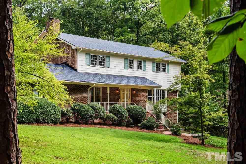 2942 Buckingham Road Durham, NC 27707 - Photo 1 of 25 a front view of a house with a yard