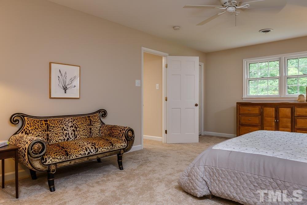 2942 Buckingham Road Durham, NC 27707 - Photo 13 of 25 a bedroom with a bed and a window