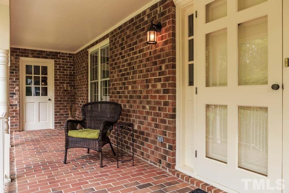 2942 Buckingham Road Durham, NC 27707 - Photo 3 of 25 a view of a door with a chair and bench