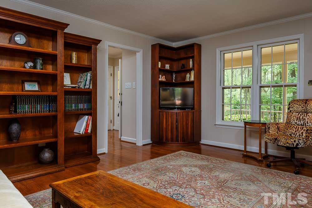 2942 Buckingham Road Durham, NC 27707 - Photo 10 of 25 a living room with fireplace furniture and a window