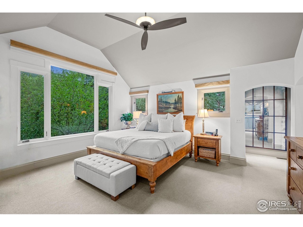820 6th Street Boulder, CO 80302 - Photo 12 of 29 a spacious bedroom with a bed couch and large window
