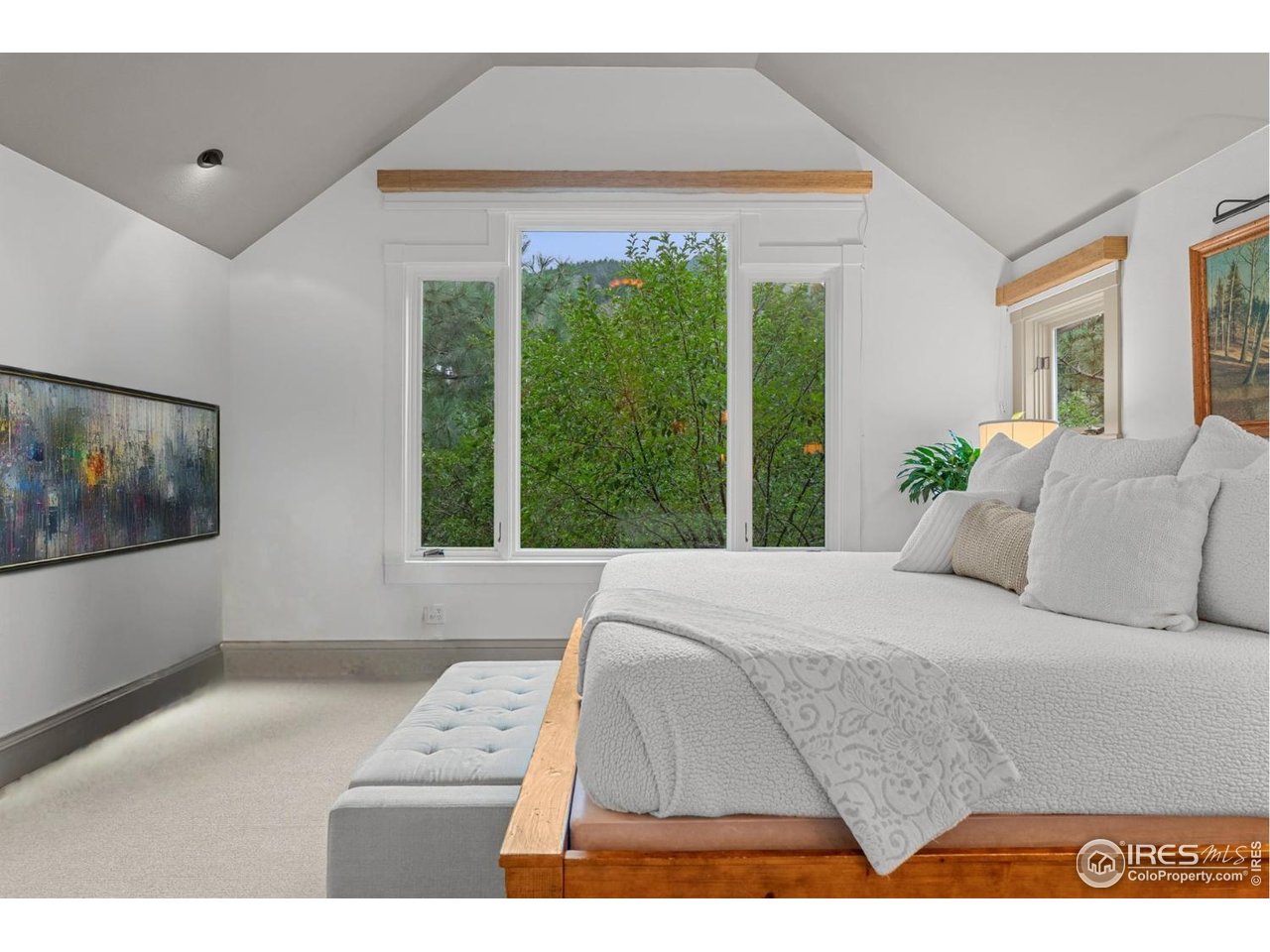 820 6th Street Boulder, CO 80302 - Photo 14 of 29 a living room with a bed furniture and a large window