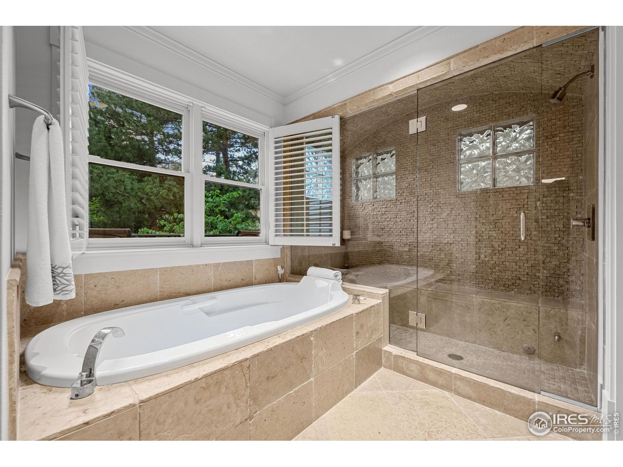 820 6th Street Boulder, CO 80302 - Photo 17 of 29 a bathroom with a bathtub and a shower