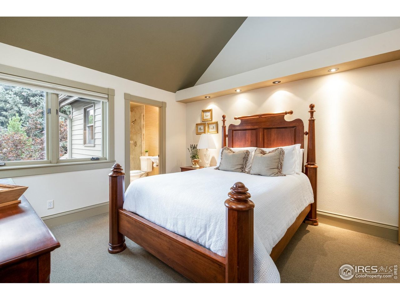 820 6th Street Boulder, CO 80302 - Photo 19 of 29 a bed sitting in a bedroom next to a window