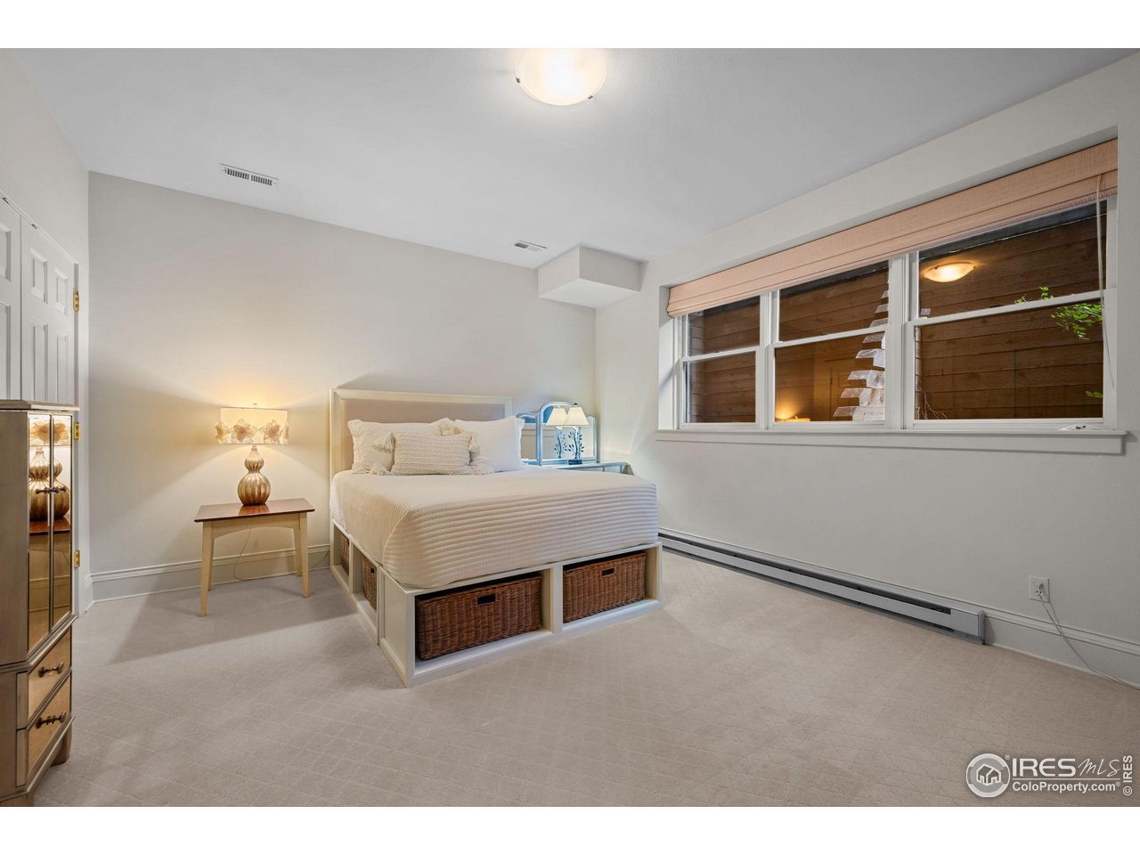 820 6th Street Boulder, CO 80302 - Photo 20 of 29 a spacious bedroom with a bed and a window