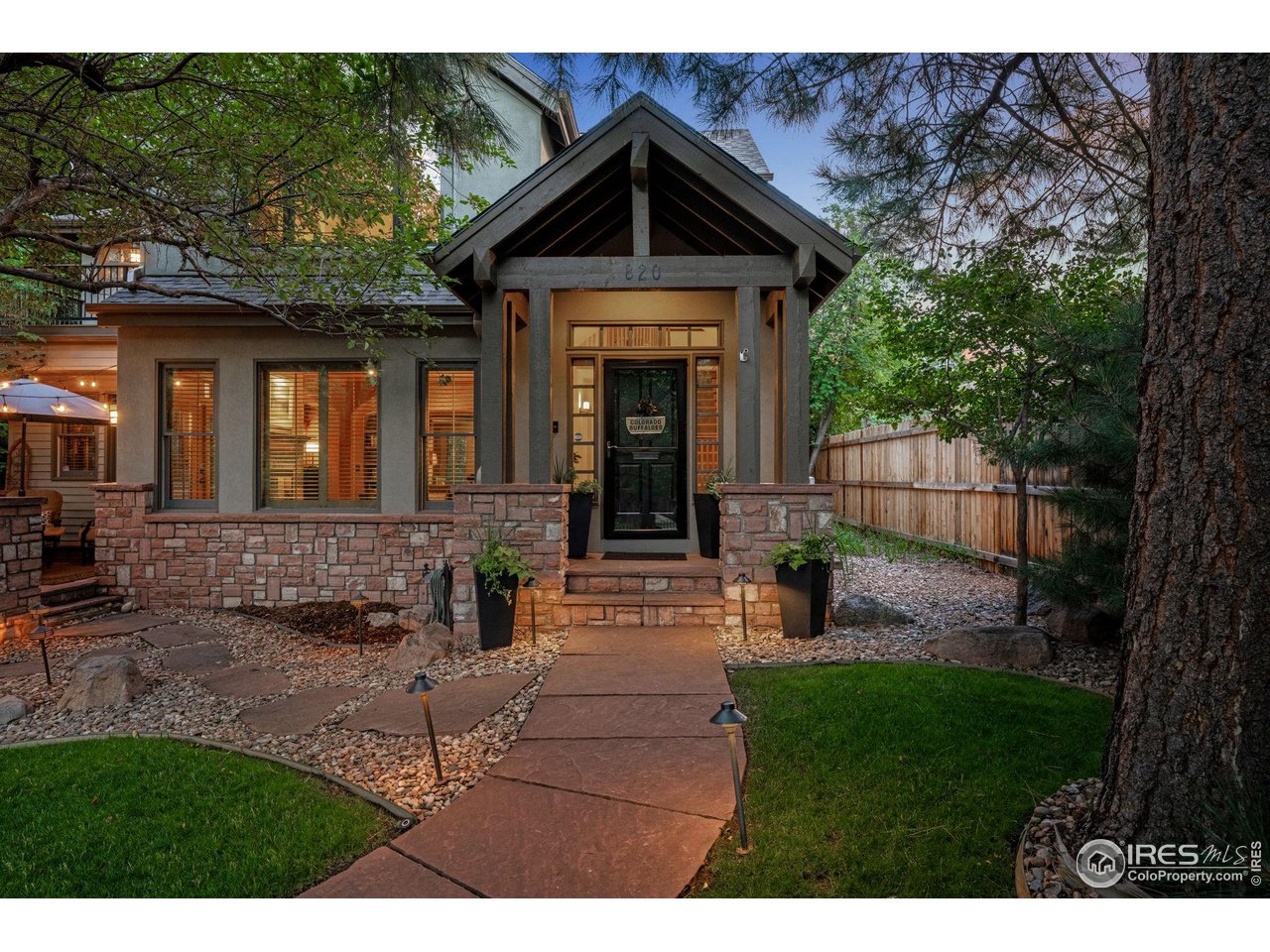 820 6th Street Boulder, CO 80302 - Photo 2 of 29 a front view of a house with garden