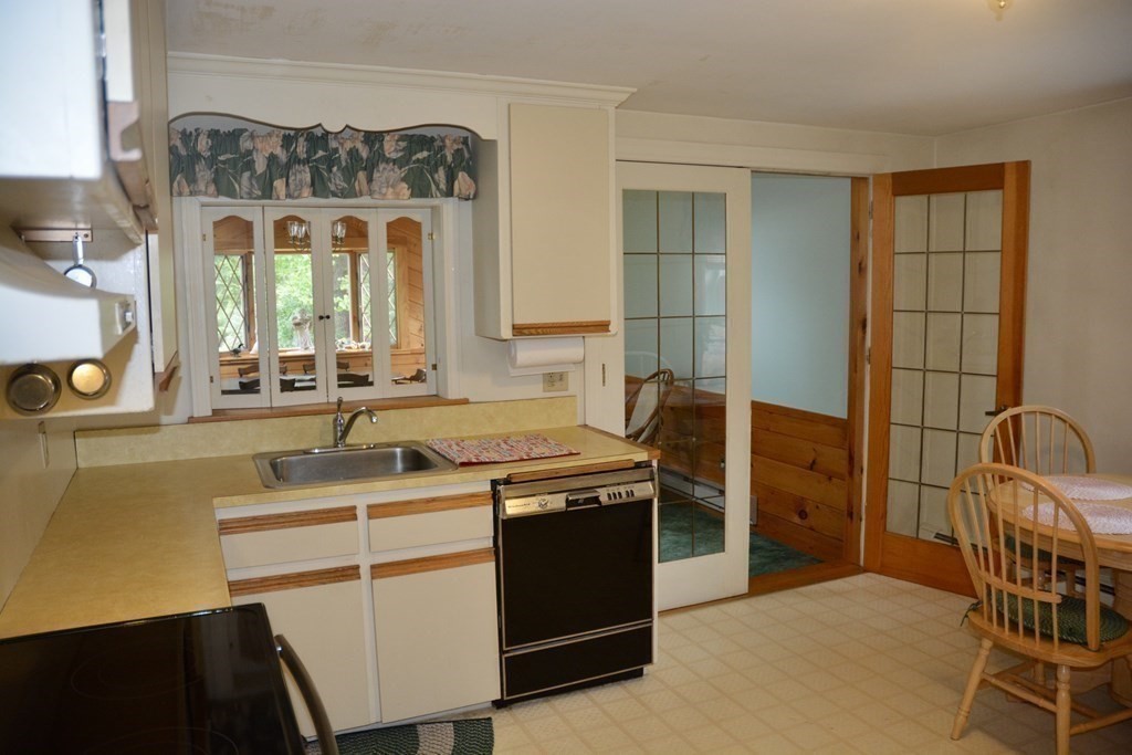 48 Randolph Street Canton, MA 02021 - Photo 17 of 21 a kitchen with stainless steel appliances granite countertop a stove a sink and a refrigerator