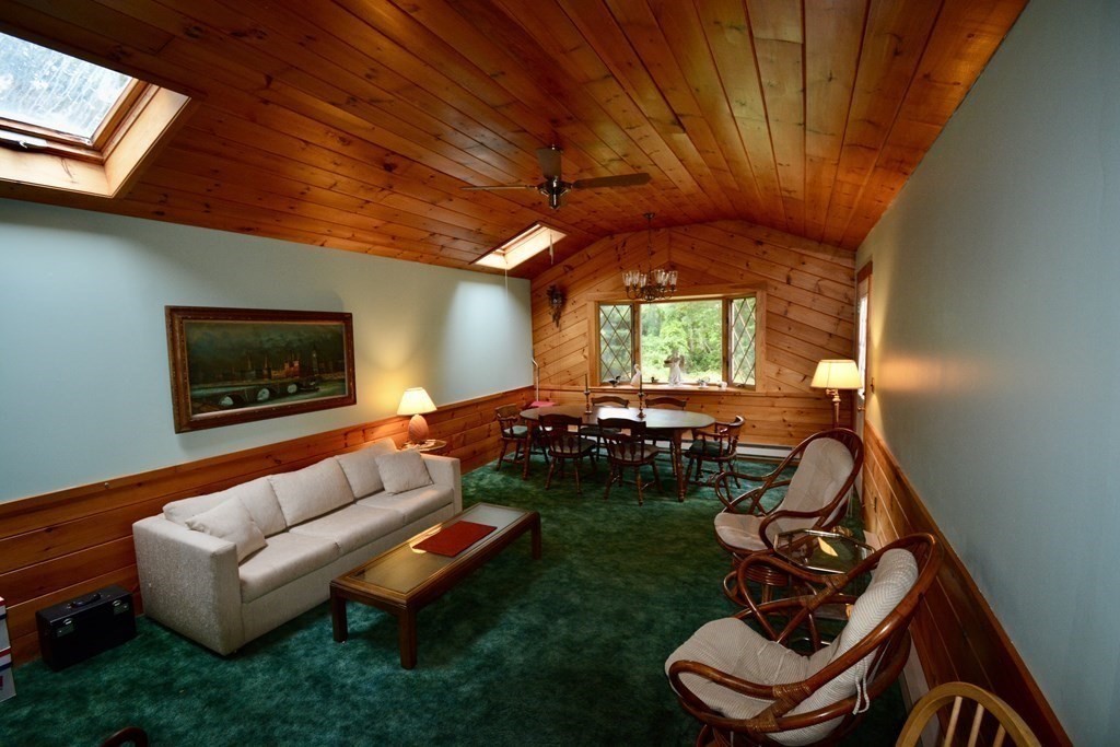 48 Randolph Street Canton, MA 02021 - Photo 2 of 21 a living room with furniture and a fireplace