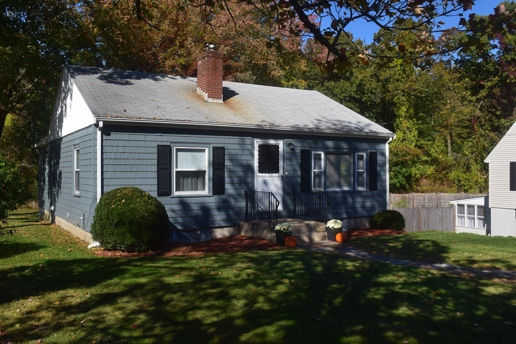 48 Randolph Street Canton, MA 02021 - Photo 4 of 21 a front view of a house with a garden