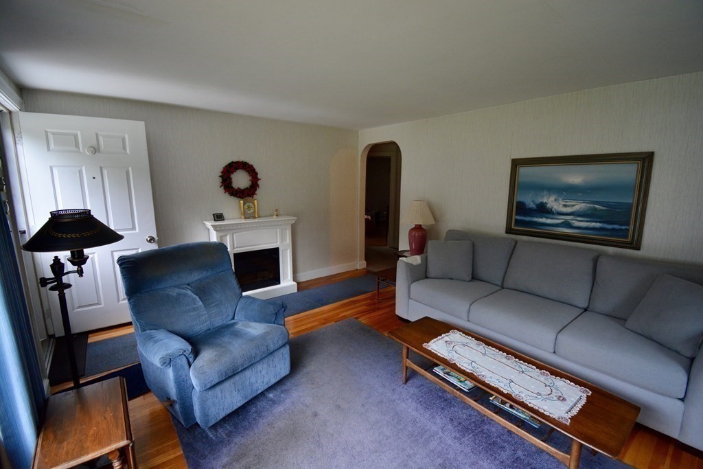48 Randolph Street Canton, MA 02021 - Photo 8 of 21 a living room with furniture fireplace and window