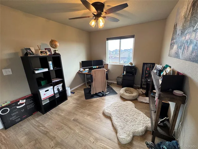 a bedroom with furniture and a window