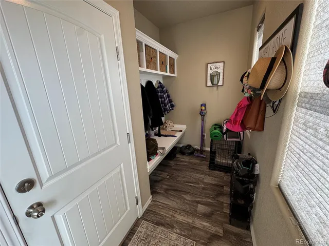 a view of a hallway with furniture and entryway