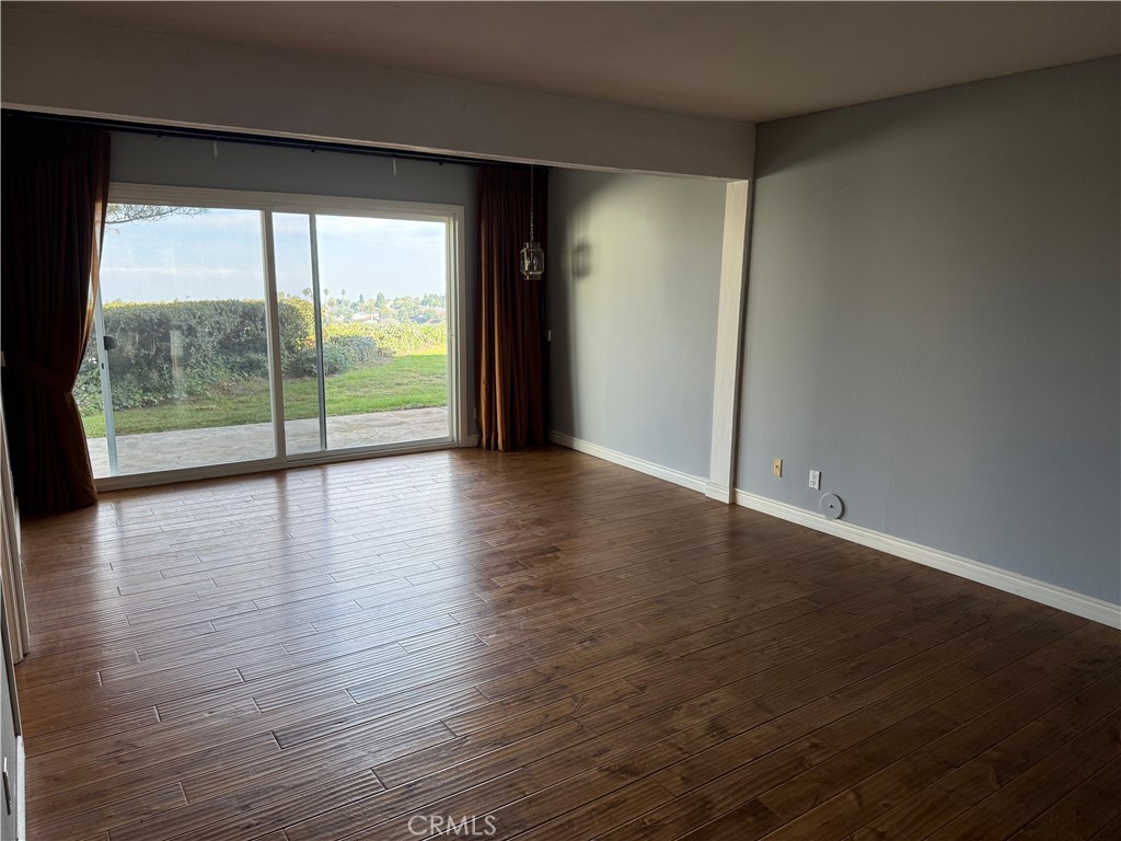 1 Oaktree Lane Rolling Hills Estates, CA 90274 - Photo 12 of 20 wooden floor in an empty room with a window