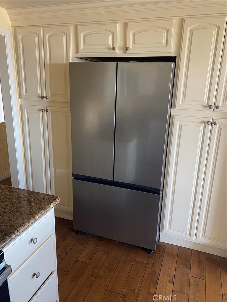 1 Oaktree Lane Rolling Hills Estates, CA 90274 - Photo 8 of 20 a view of a refrigerator in kitchen with wooden floor