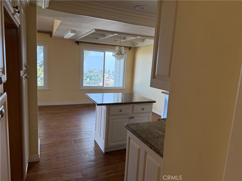 1 Oaktree Lane Rolling Hills Estates, CA 90274 - Photo 9 of 20 a kitchen with granite countertop white cabinets and wooden floor