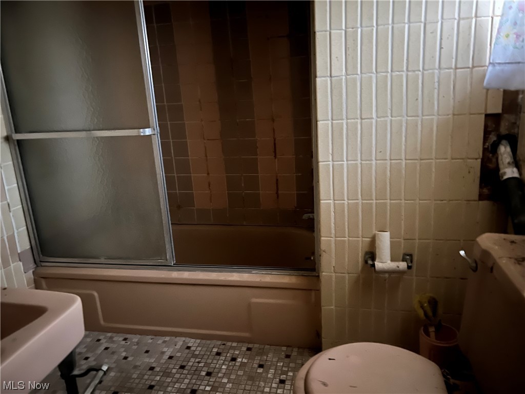 72553 Colerain Road Dillonvale, OH 43917 - Photo 25 of 31 Full bathroom featuring sink, tile flooring, shower / bath combination with glass door, and toilet