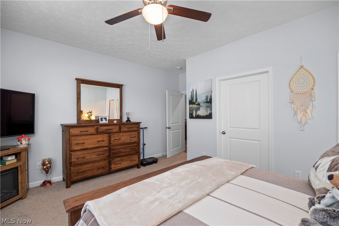109 West Spring Drive Elyria, OH 44035 - Photo 34 of 46 Carpeted room featuring a ceiling fan with integrated lighting, light gray wall paint, and white paneled doors