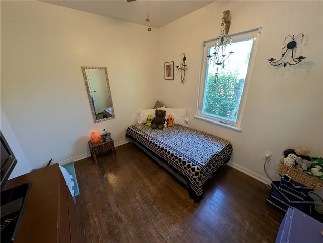 a bedroom with bed and window