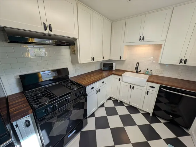 a kitchen with a stove a sink and dishwasher