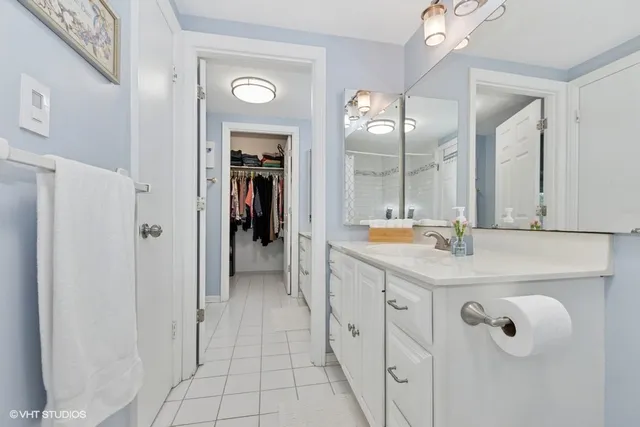 a bathroom with a double vanity sink and a mirror