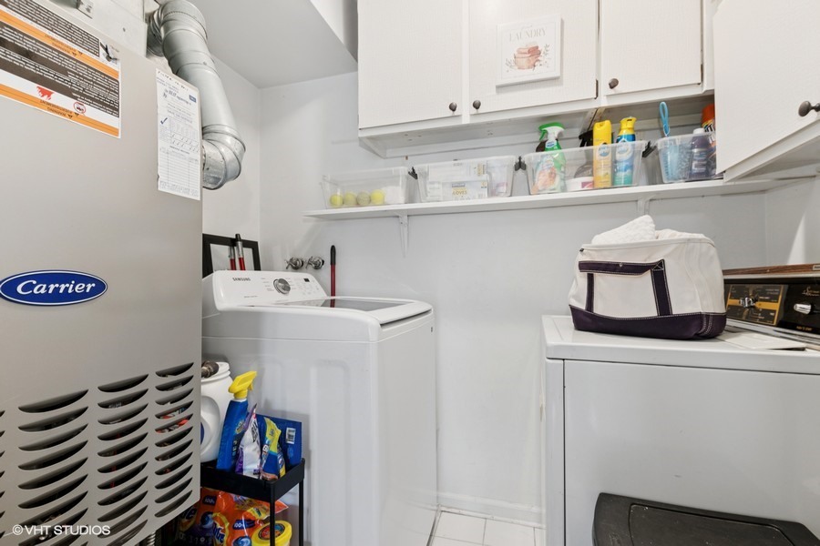 128 Carriage Way Drive, Unit 217B Burr Ridge, IL 60527 - Photo 18 of 20 a room with storage and utility