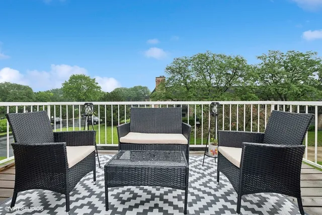 a view of a chairs and table on the deck