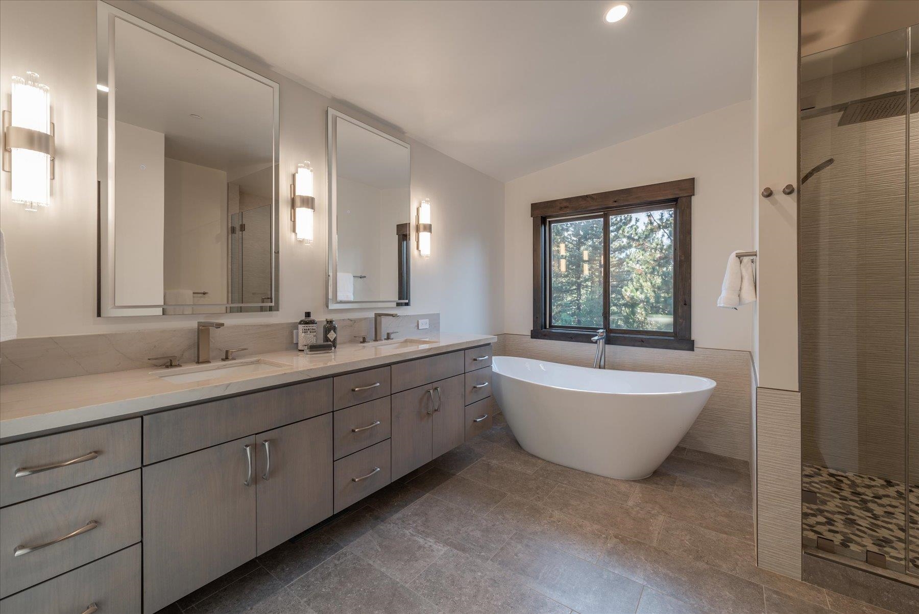 15330 Wolfgang Road Truckee, CA 96161 - Photo 11 of 21 a bathroom with a bathtub sink mirror and toilet