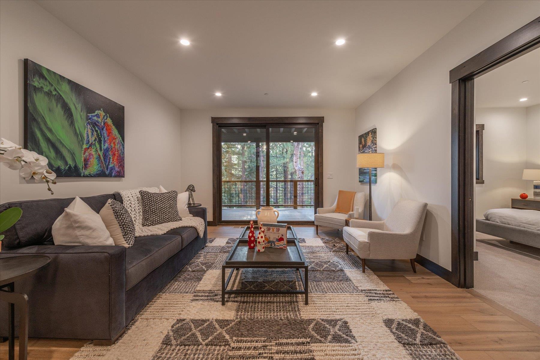 15330 Wolfgang Road Truckee, CA 96161 - Photo 13 of 21 a living room with furniture wooden floor and a large window