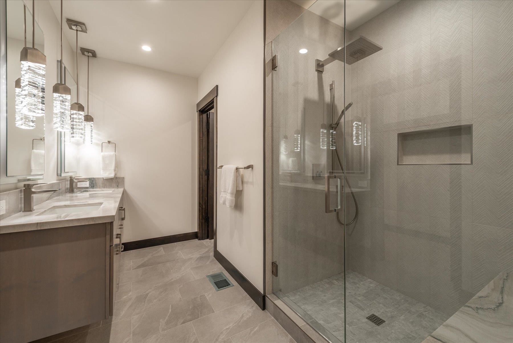 15330 Wolfgang Road Truckee, CA 96161 - Photo 19 of 21 a bathroom with a shower sink and mirror